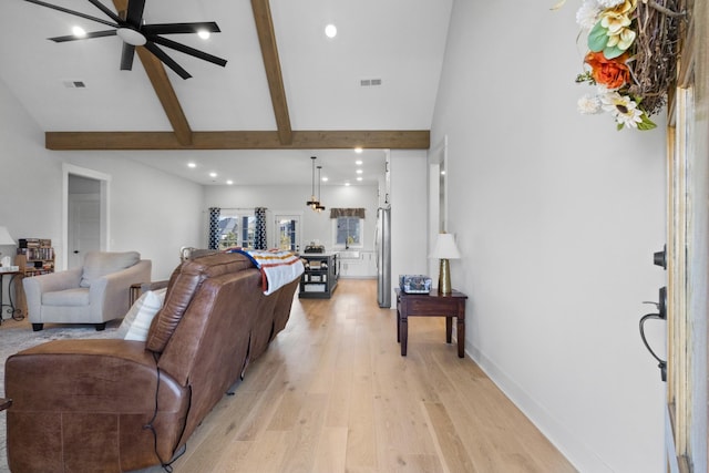 living area with recessed lighting, baseboards, visible vents, and light wood finished floors