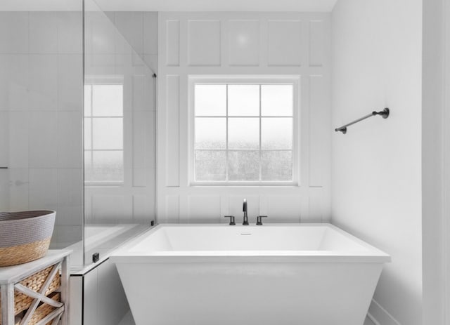 full bathroom featuring a soaking tub