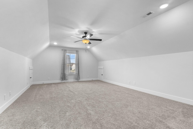 bonus room featuring vaulted ceiling, ceiling fan, carpet, and baseboards