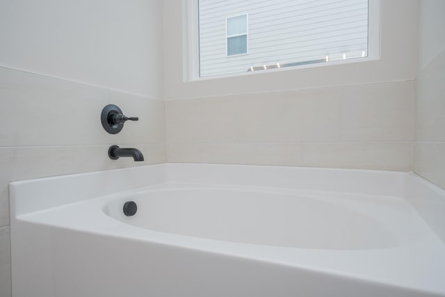 bathroom featuring a garden tub