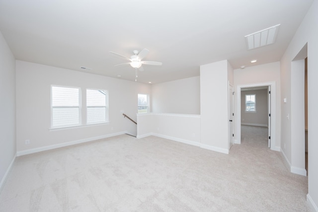 empty room with baseboards, recessed lighting, visible vents, and light colored carpet