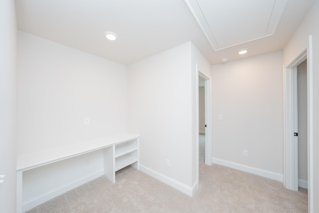 interior space featuring light carpet, baseboards, attic access, and recessed lighting