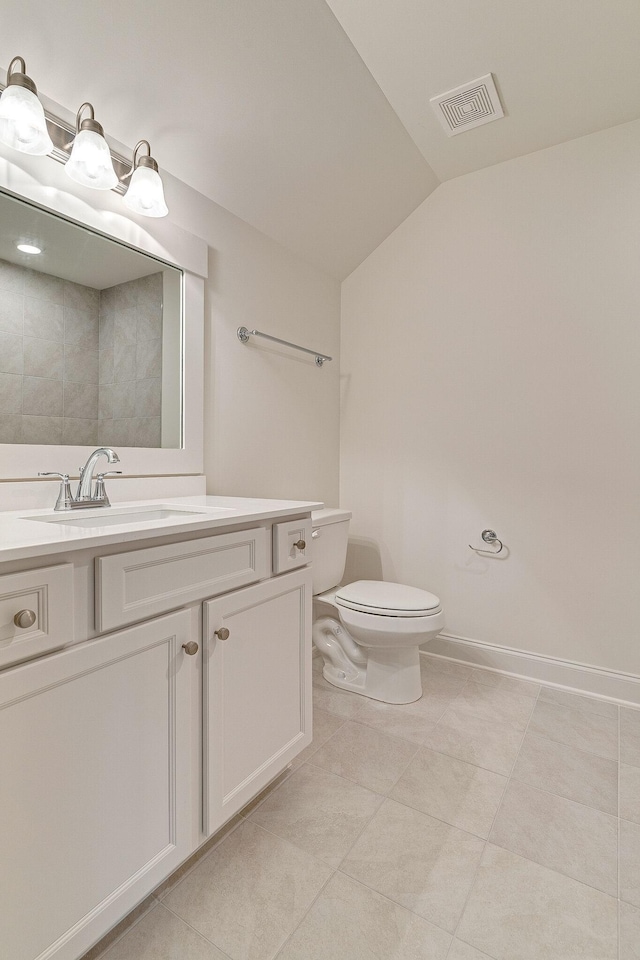 bathroom with visible vents, vaulted ceiling, vanity, and toilet