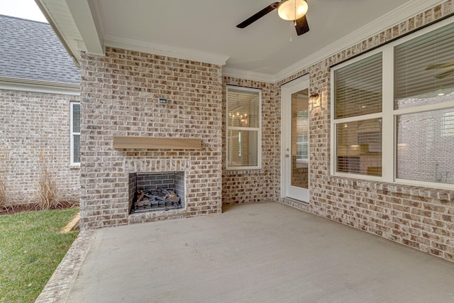 view of patio with an outdoor brick fireplace and a ceiling fan