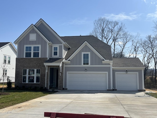 view of front facade featuring brick siding, board and batten siding, concrete driveway, and a shingled roof