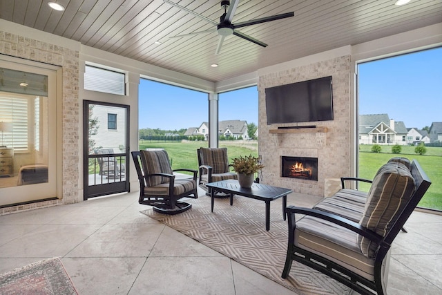 6324 Percheron Ln, Arrington, TN 37014 - sunroom / solarium featuring a ceiling fan, wooden ceiling, and a fireplace
