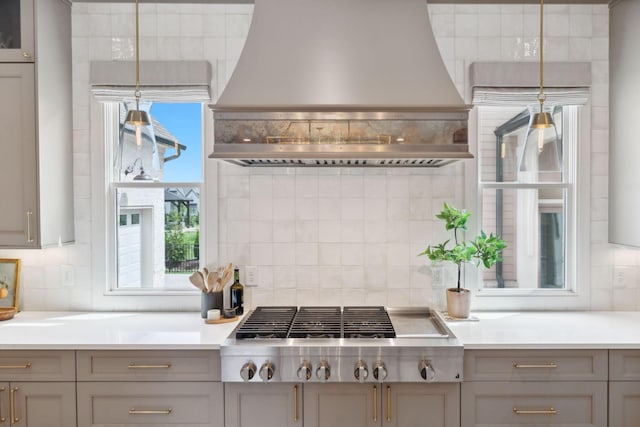 6324 Percheron Ln, Arrington, TN 37014 - kitchen with stainless steel gas cooktop, premium range hood, light countertops, decorative backsplash, and pendant lighting