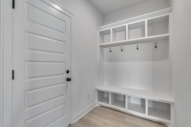 mudroom featuring light wood-style floors and baseboards