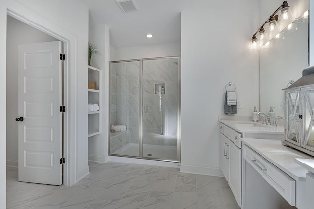 full bath with a stall shower, marble finish floor, visible vents, and vanity