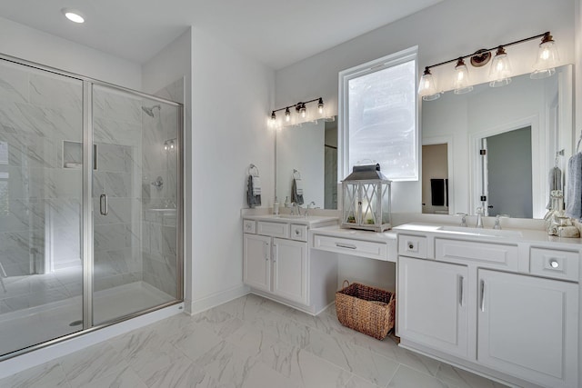 full bathroom with a sink, marble finish floor, a stall shower, and double vanity