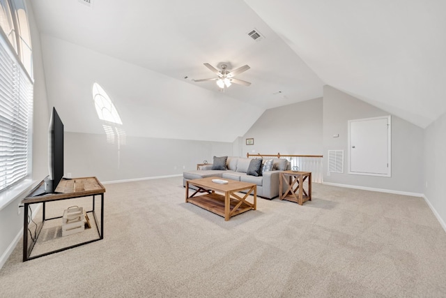 living area featuring vaulted ceiling, carpet, visible vents, and baseboards