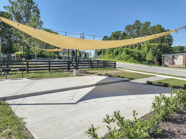 view of property's community featuring fence