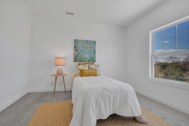 bedroom featuring baseboards and carpet flooring