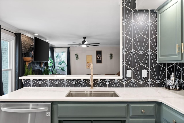 kitchen featuring tasteful backsplash, green cabinetry, ceiling fan, and stainless steel dishwasher