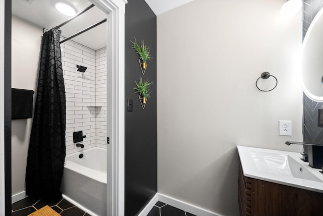 bathroom with shower / bath combo, vanity, baseboards, and tile patterned floors