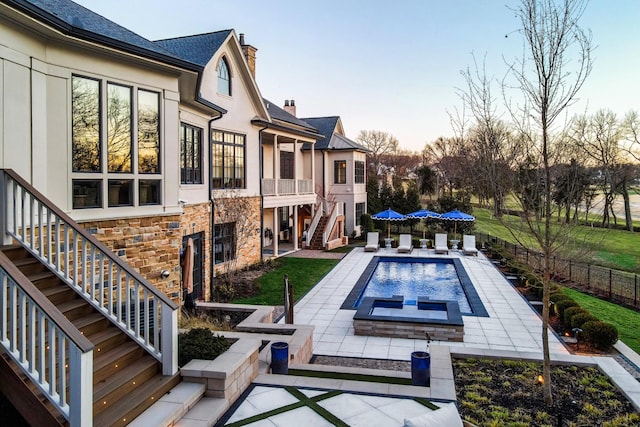 view of swimming pool featuring a fenced backyard, stairs, a fenced in pool, and a patio