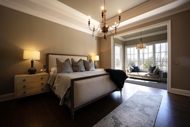 bedroom with crown molding, dark wood finished floors, a notable chandelier, a raised ceiling, and baseboards