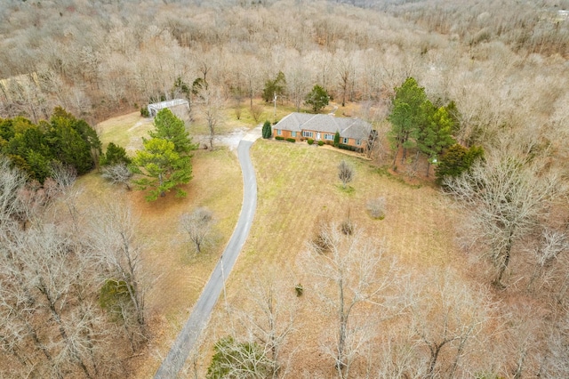 birds eye view of property with a forest view