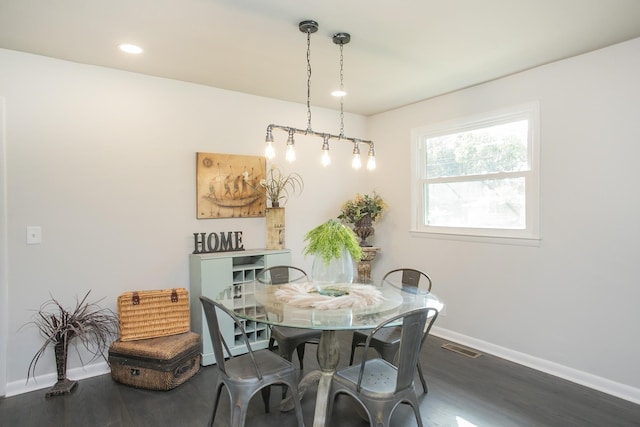 dining area featuring baseboards, visible vents, dark wood finished floors, and recessed lighting