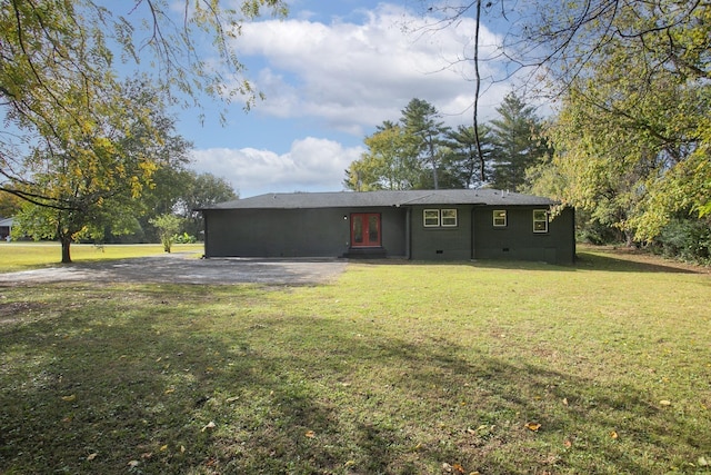 ranch-style home featuring french doors, a front lawn, and crawl space