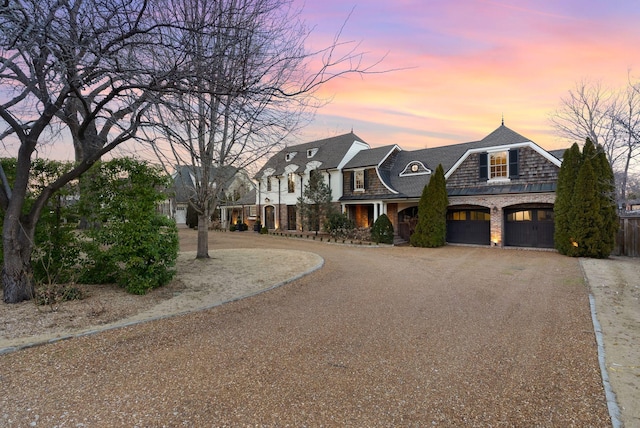 view of front of house with brick siding and driveway