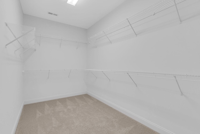 spacious closet with visible vents and carpet flooring