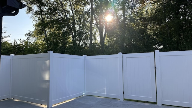 view of gate with fence