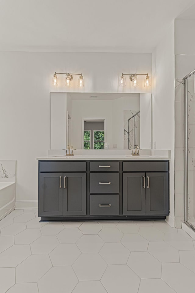 full bath with a garden tub, a sink, a shower stall, and double vanity