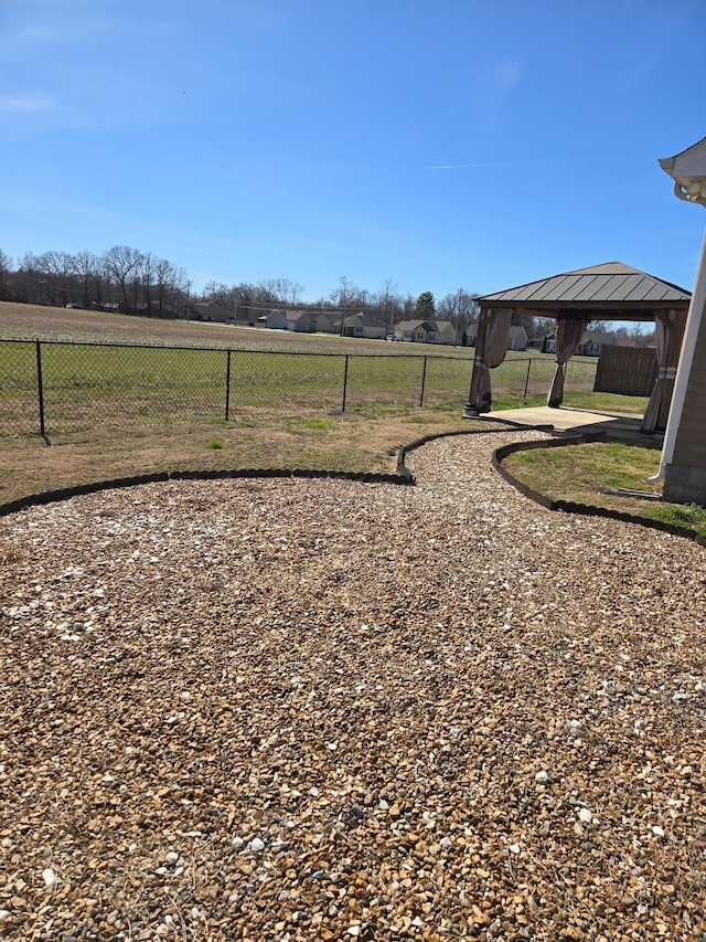 view of yard featuring a gazebo and fence