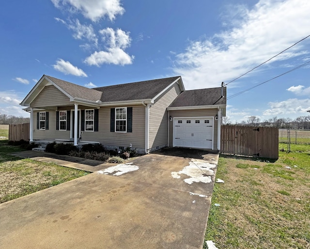 single story home with a garage, driveway, and fence