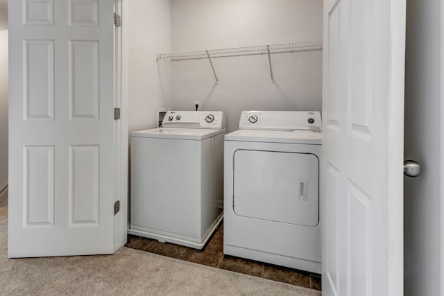 laundry area with laundry area, carpet, and washer and dryer