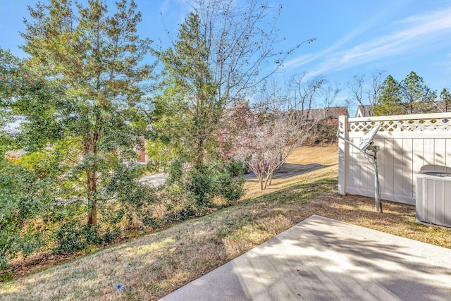 view of yard with a patio area and central AC