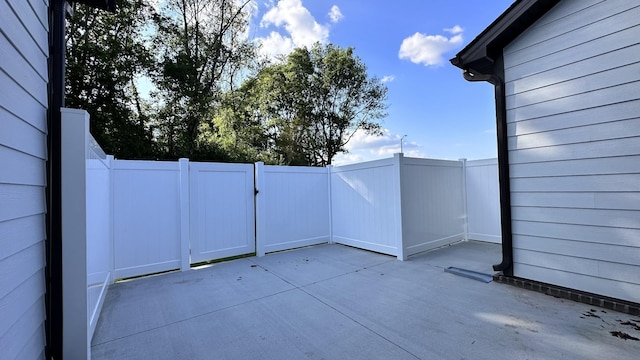 view of patio / terrace featuring fence