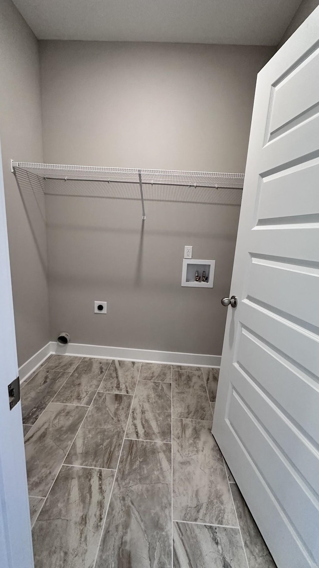 laundry room featuring washer hookup, laundry area, electric dryer hookup, and baseboards