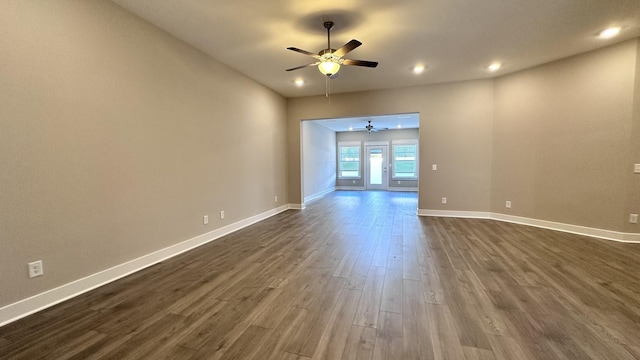 unfurnished room featuring dark wood-type flooring, recessed lighting, baseboards, and a ceiling fan