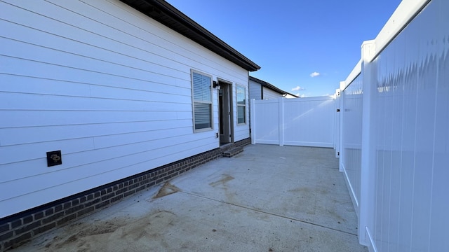 view of patio / terrace with a gate and fence