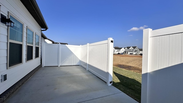 view of patio featuring fence