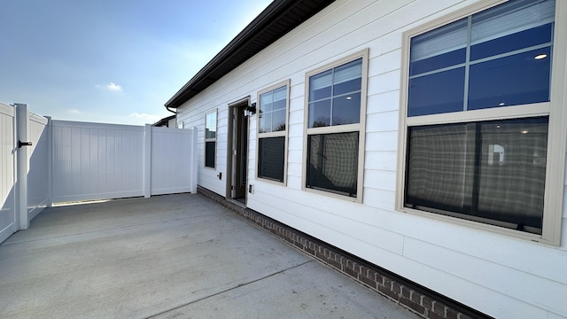 view of patio / terrace featuring fence