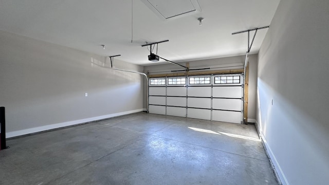 garage featuring baseboards and a garage door opener