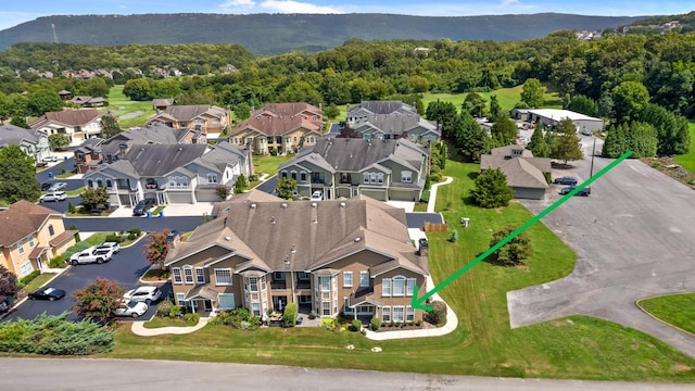 birds eye view of property with a wooded view and a residential view