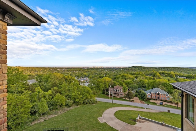 exterior space featuring a wooded view