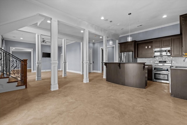 kitchen with appliances with stainless steel finishes, concrete flooring, ornate columns, and tasteful backsplash