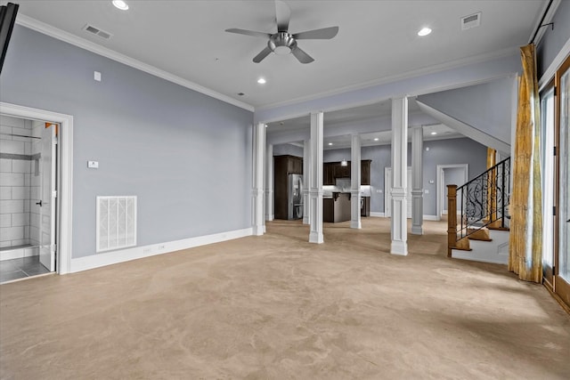 interior space featuring stairs, decorative columns, and visible vents