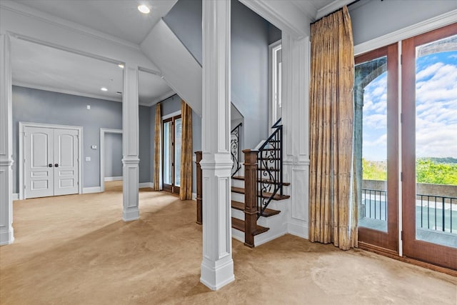 foyer with recessed lighting, stairs, french doors, ornamental molding, and ornate columns