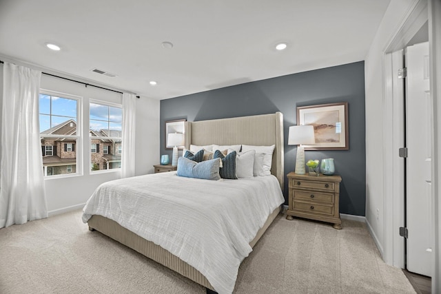 carpeted bedroom featuring baseboards, visible vents, and recessed lighting