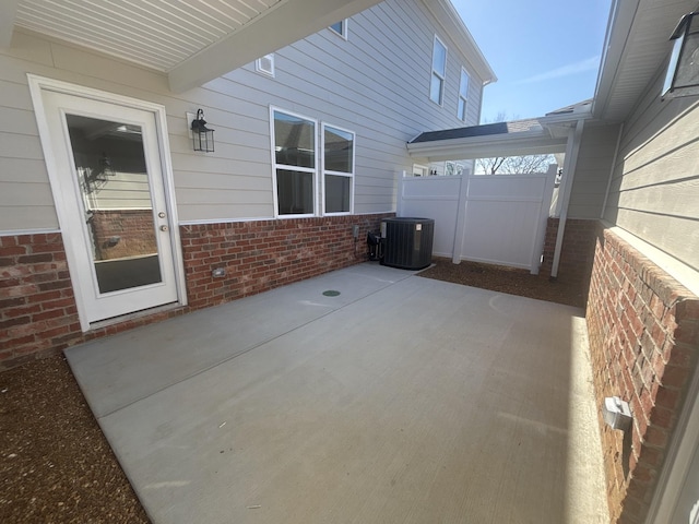 view of patio featuring fence and central air condition unit