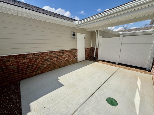 view of patio / terrace featuring fence