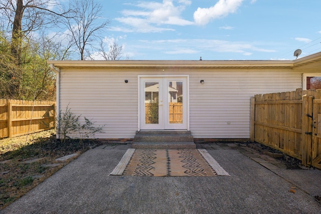 exterior space with french doors, fence, and a patio