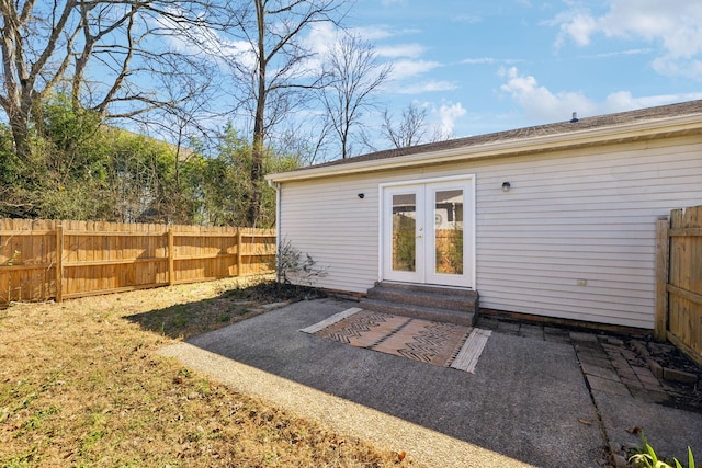 exterior space featuring entry steps, fence, and french doors