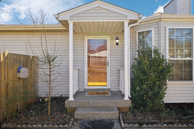 doorway to property with fence